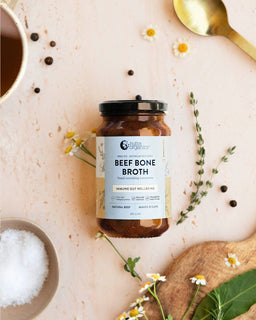 a flat lay image of a jar of beef bone broth concentrate natural beef
