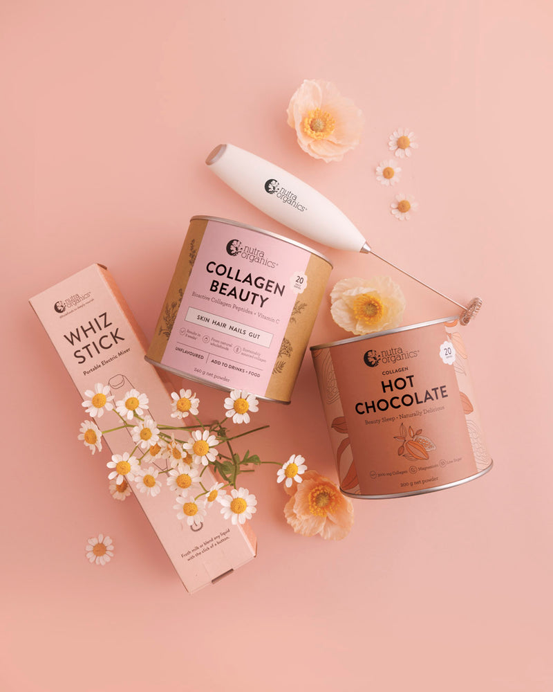 Collagen Beauty, Hot Chocolate, and a Whiz Stick on a pink background