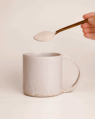 GIF: Collagen Beauty powder being poured into a mug
